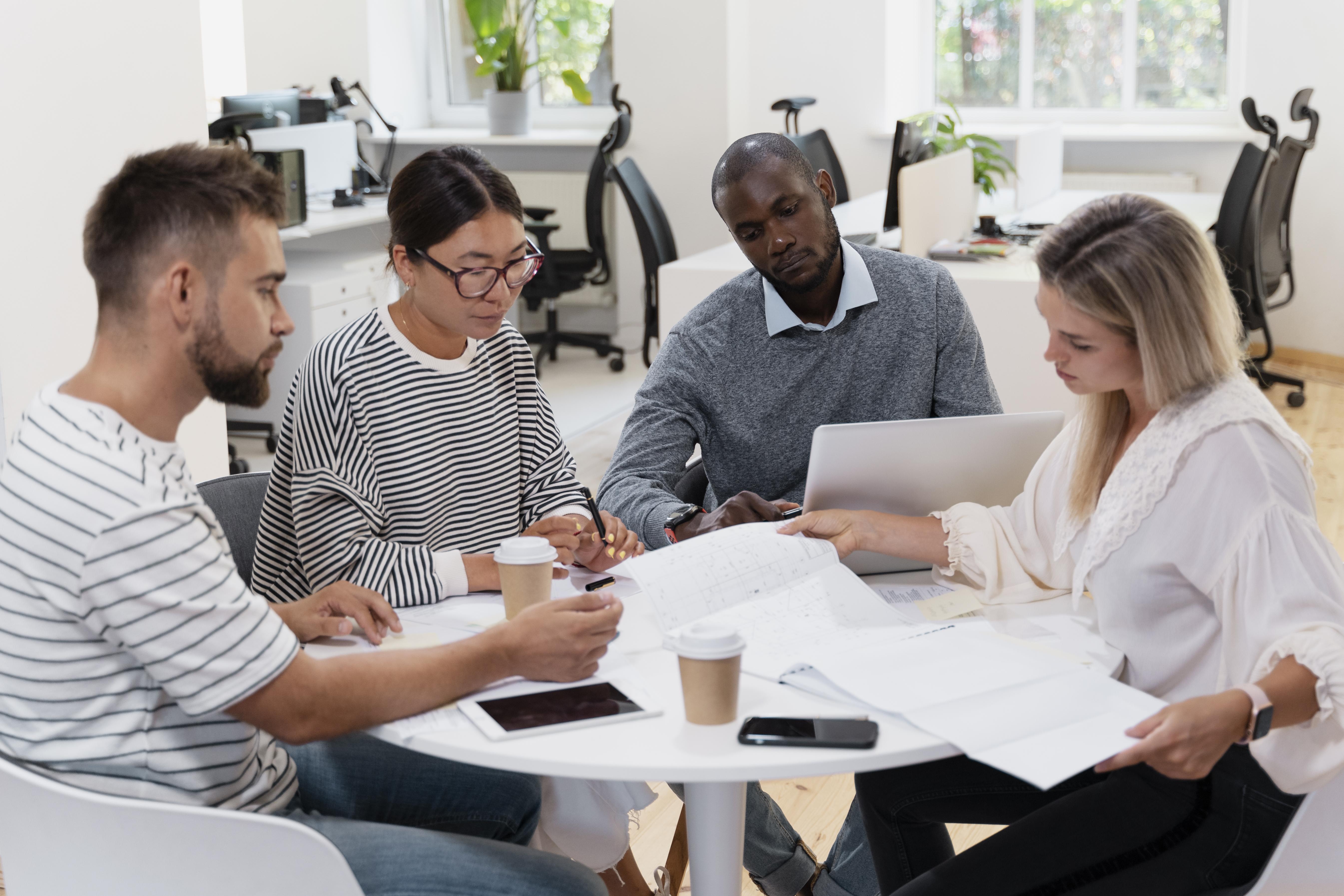 Business person giving partnership agreement to coworker