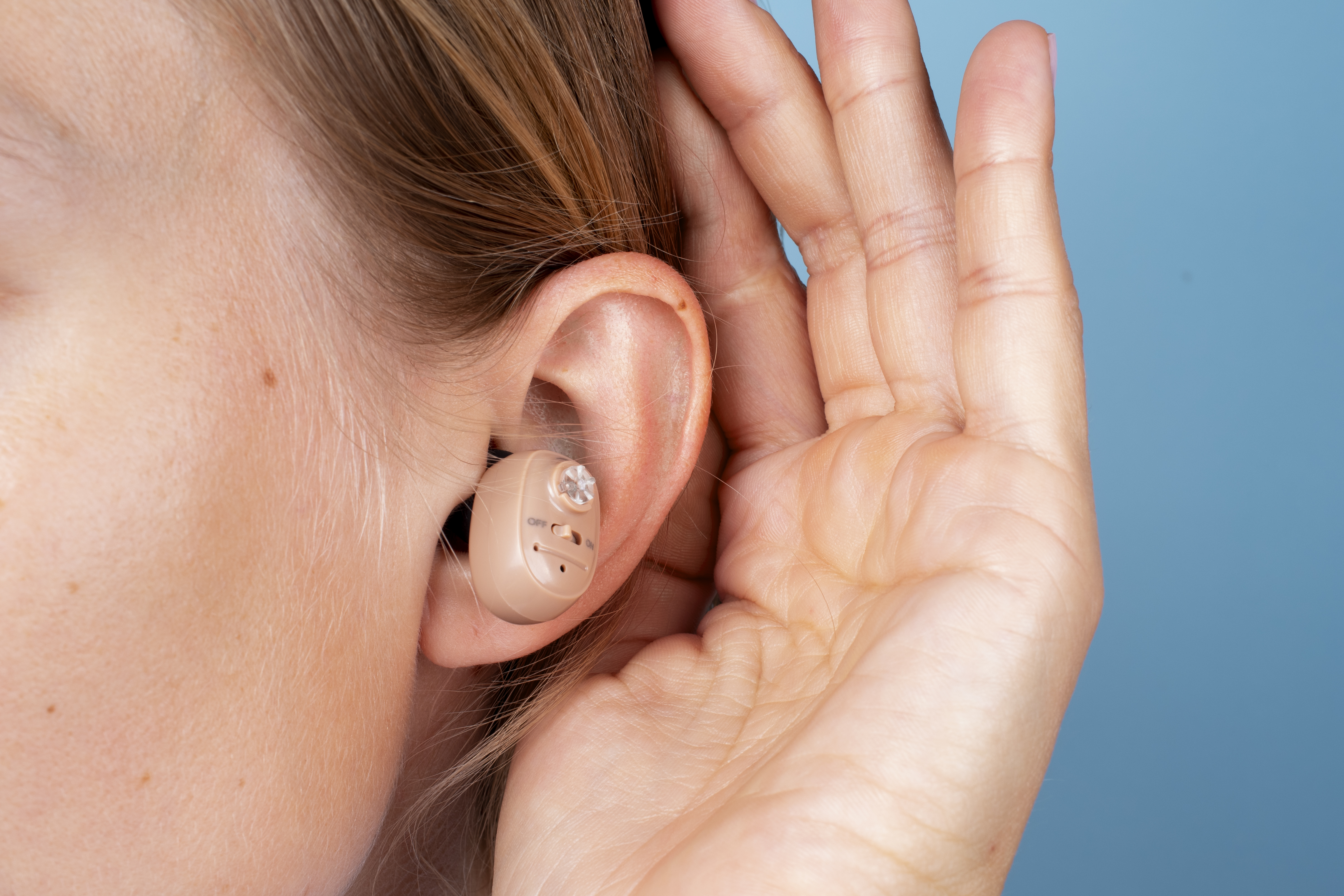 woman wearing hearing aids side view